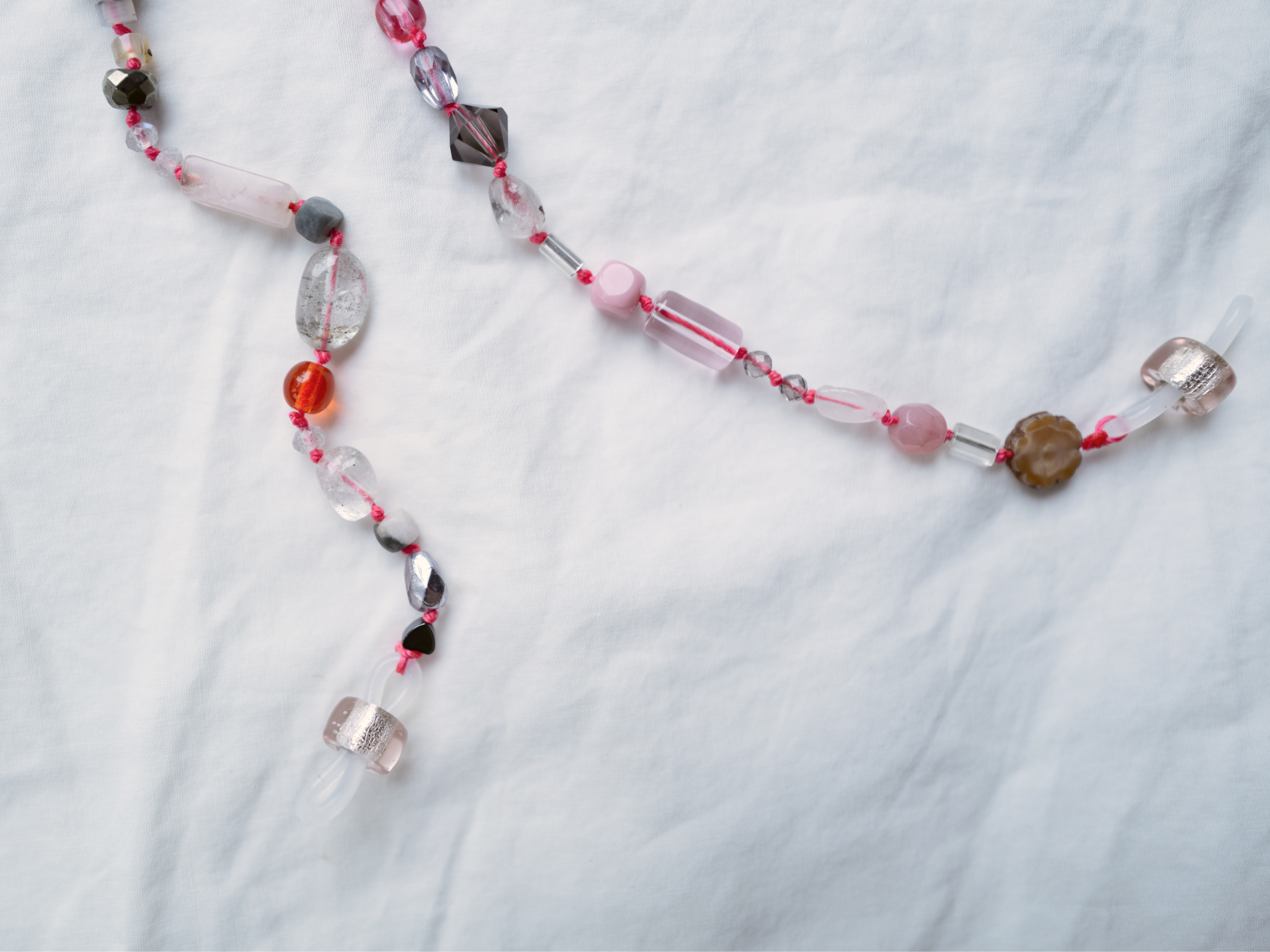 Chain detail on white linen