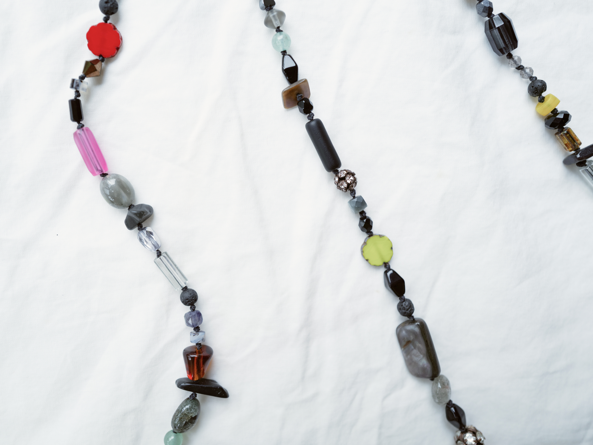 Colorful glasses chain on white linen