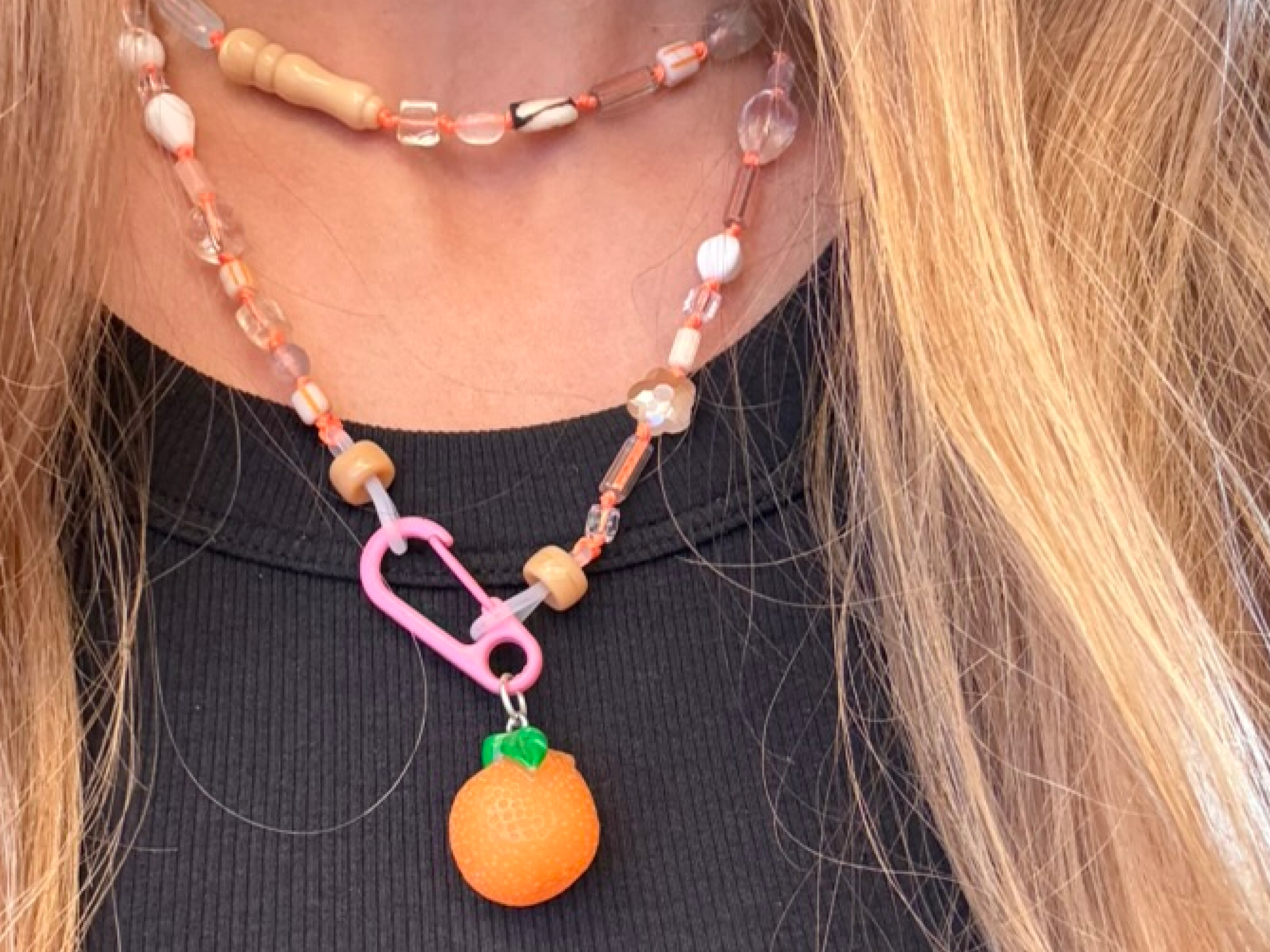 Worn with orange pendant